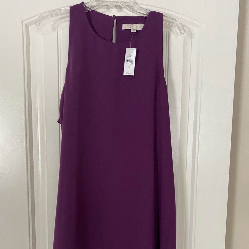 Loft purple dress with back zipper. Ruffles in back near neck and shoulders.